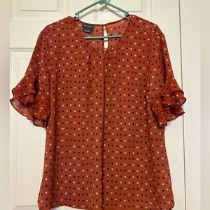 Polka dot blouse with shear ruffled sleeves